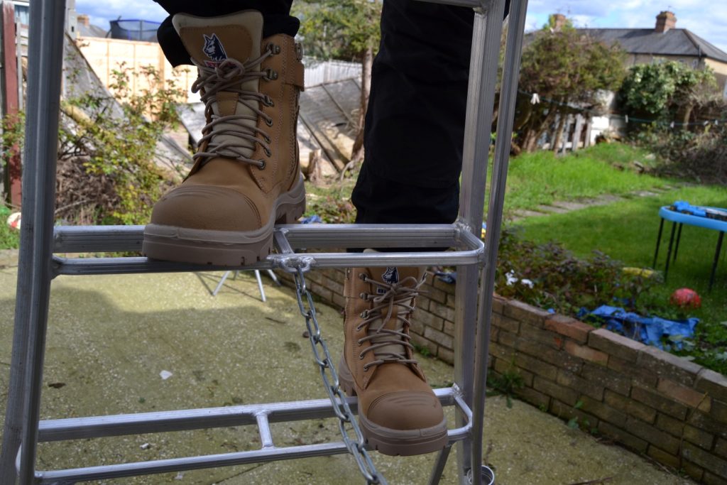 Image of a man climbing a ladder wearing Steel Blue safety boots