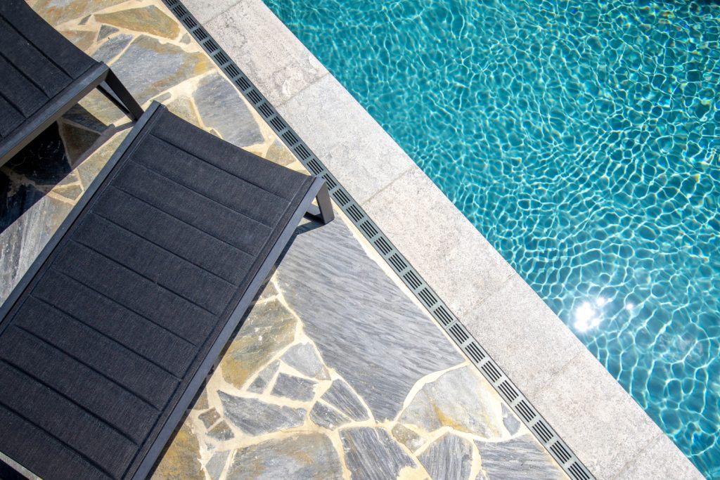 Aerial view of drainage being used next to a domestic swimming pool
