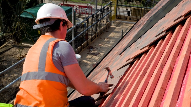 Roofer installs Marley JB Red roofing battens