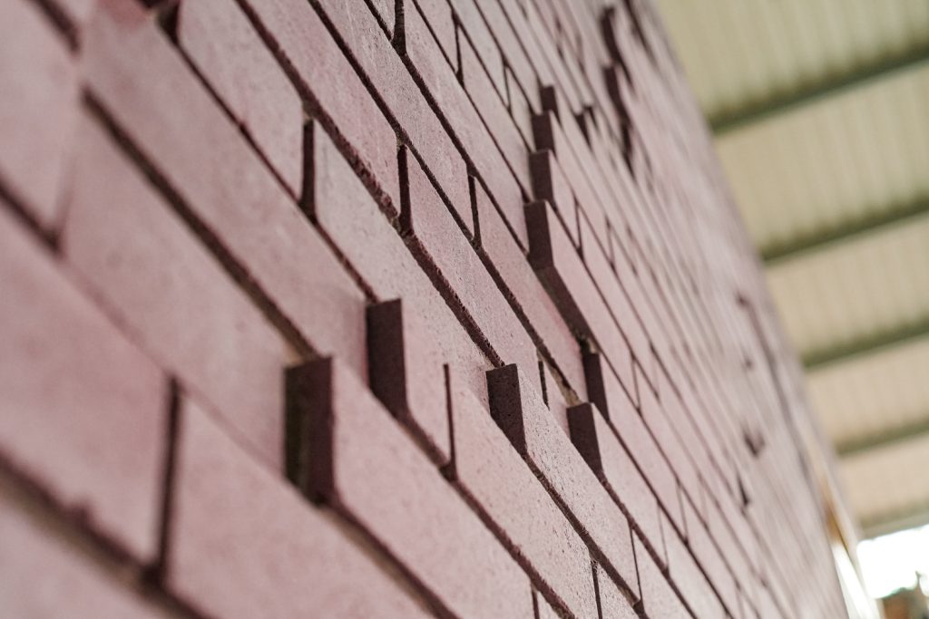 Image shows K-BRIQ bricks stacked on top of each other