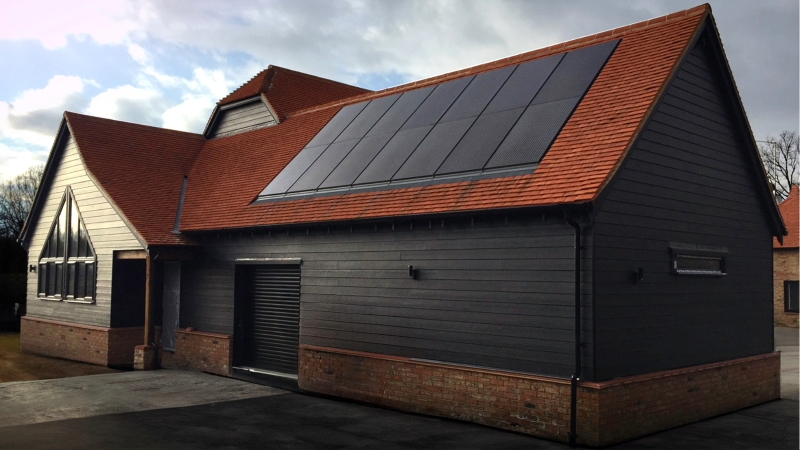 Image shows Marley solar panels on a black barn